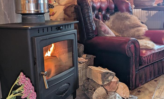 Warm your feet as the chill of the Welsh air is outside. Enjoy building your own fire inside the cabin. The cabin also has central heating if you don'